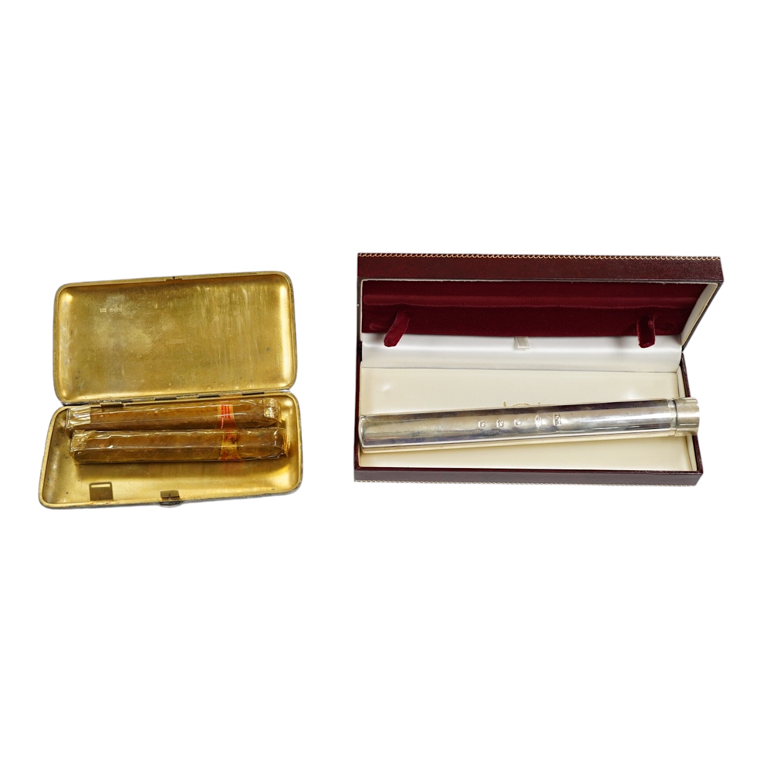 A George V silver cigar case by Sampson Mordan & Co, London, 1911, 15cm, together with a large modern silver single cigar case, AJP, London, 2007, 19.3cm. Condition - fair to good